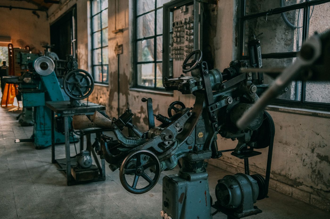 Industrial machinery running on a factory floor.