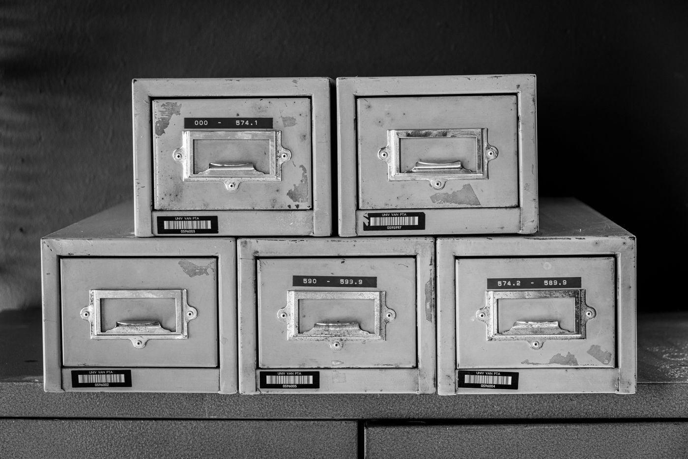 Rows of archive filing cabinets in a records room.