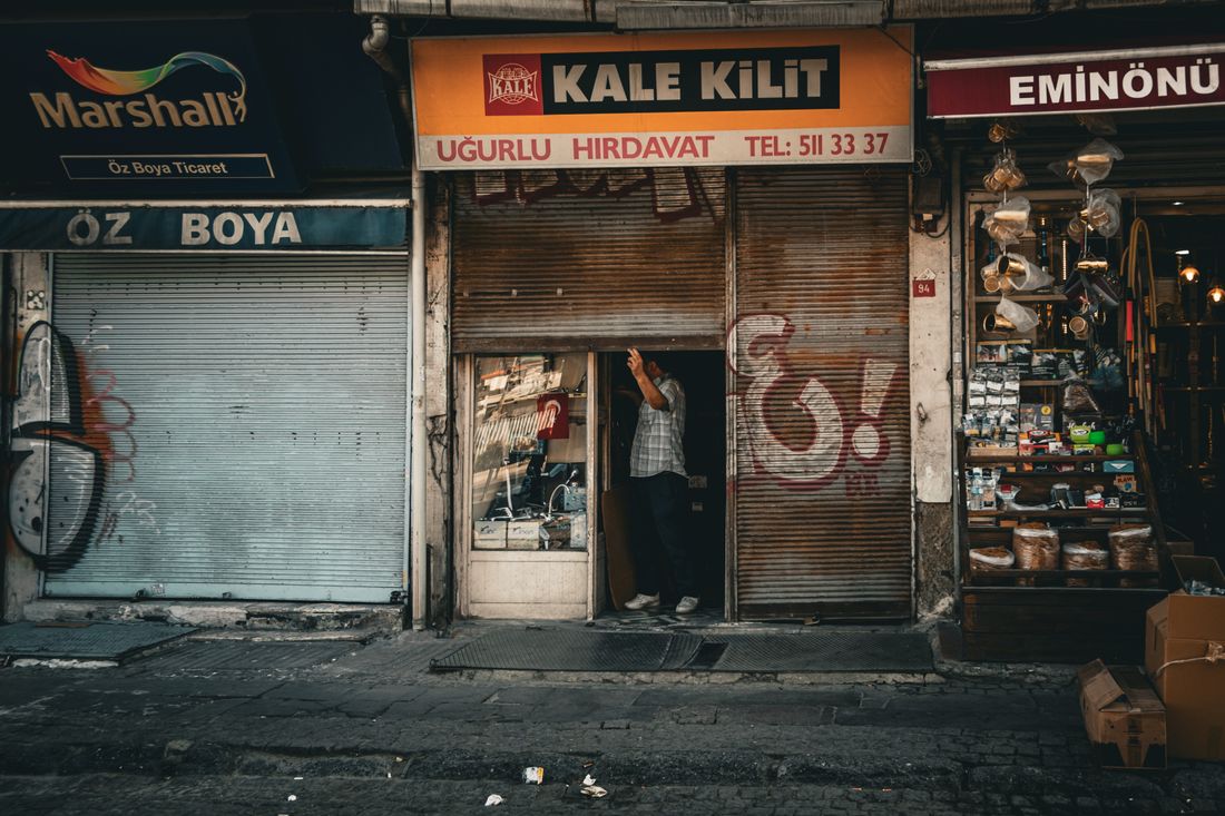 A row of small storefronts along a shopping street.